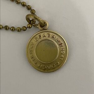 Coach est. 1941 Logo Brass Round Charm Pendant